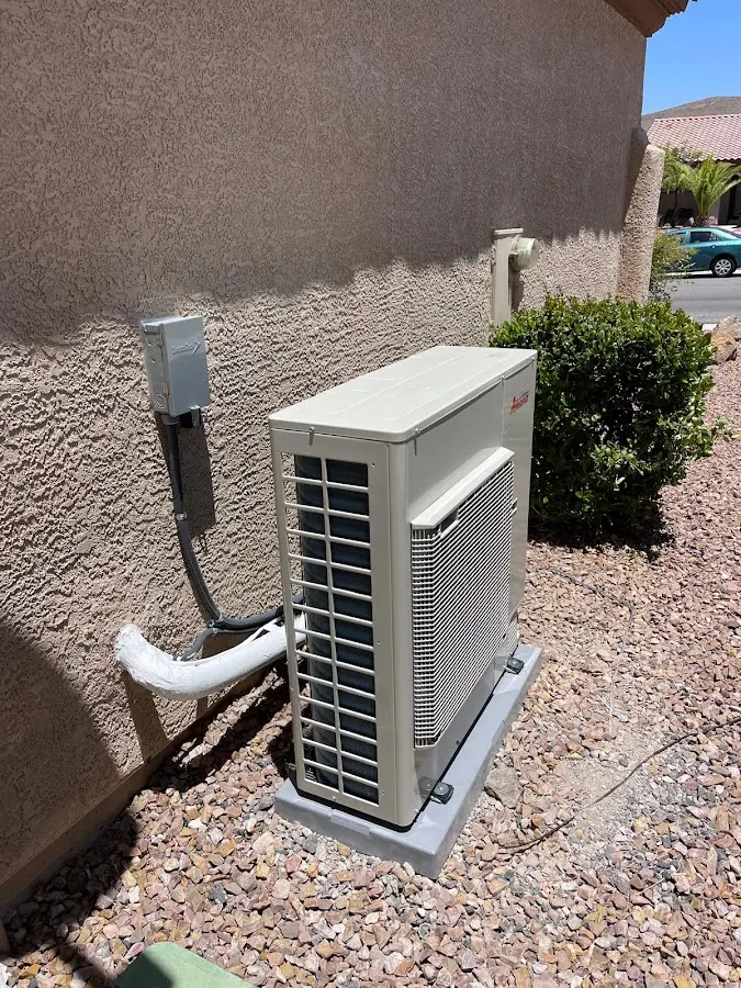 Residential air conditioning condenser unit in Alton